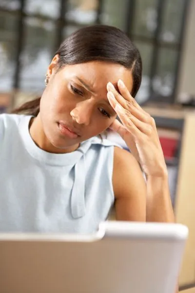 woman frustrated working on her computer
