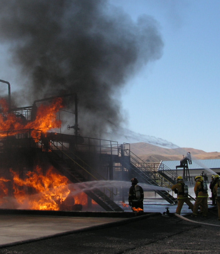 A group of firefighters battling flames after an explosion accident 