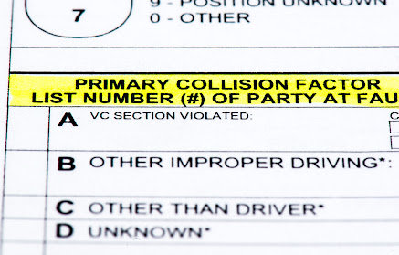 Highlighted police report for a car accident in Monroe.