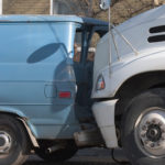 Silver truck and blue van accident