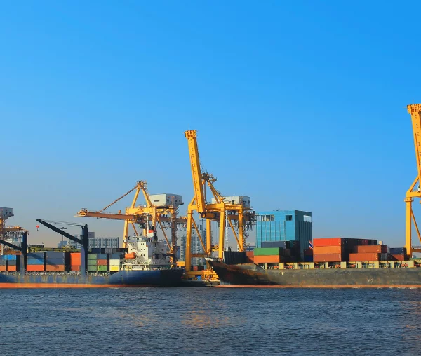 maritime law - crane in water with boat and container yard