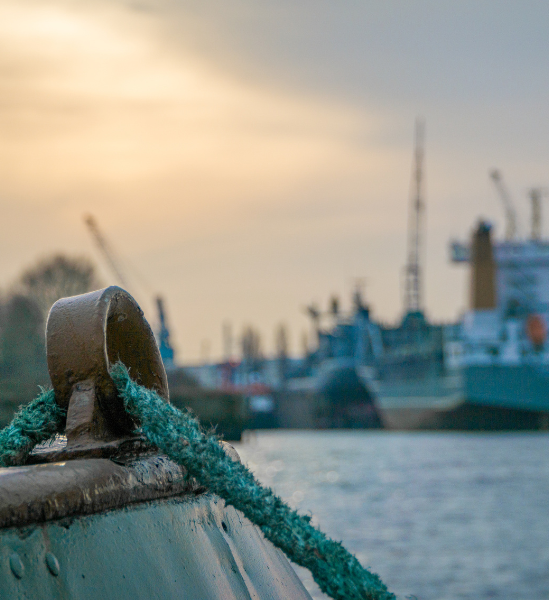 A rope and metal mooring loop on a ship docked in a Louisiana port