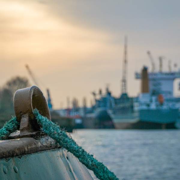 boat rope in front of a cargo ship