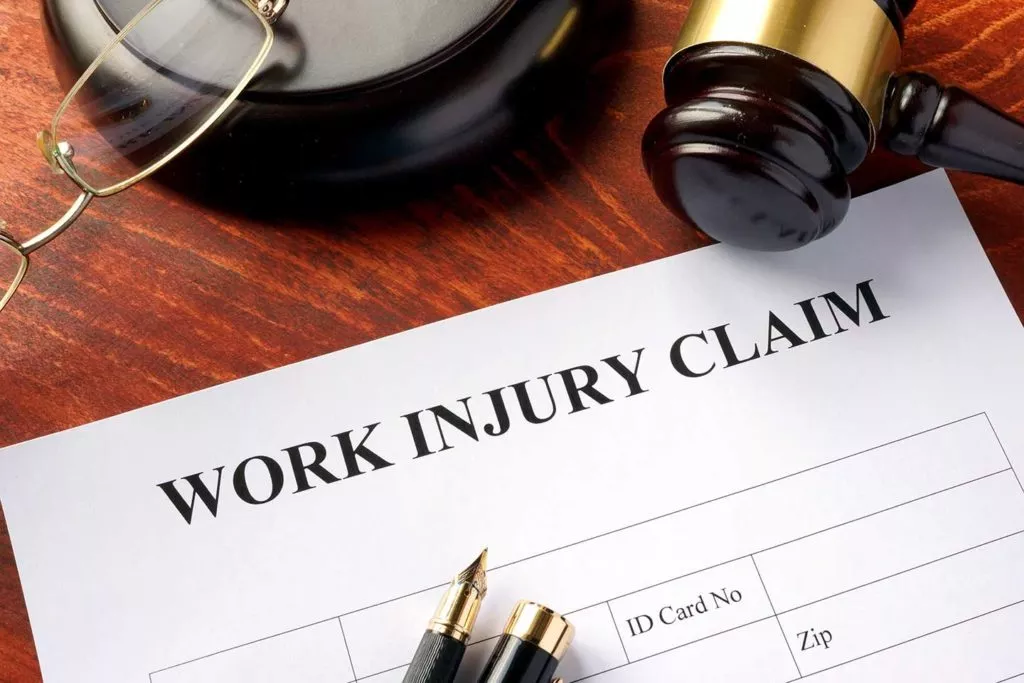 A workers' compensation form on a lawyers' desk