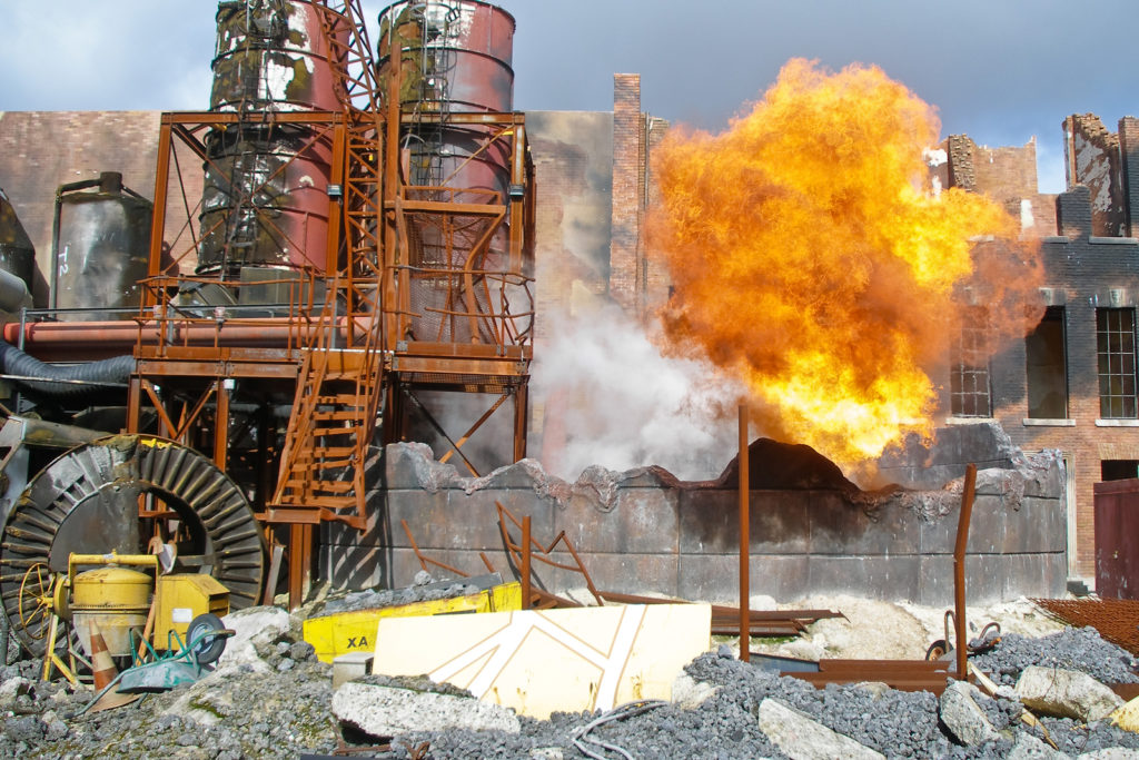 An explosion in daylight at a damaged and deteriorating factory