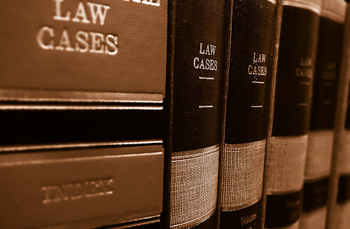 Leather-bound law books about personal injury.