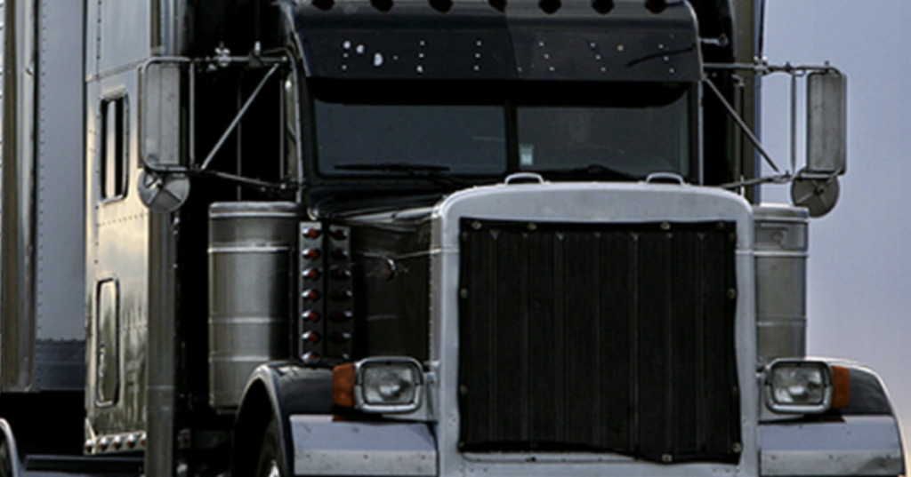 A closeup of the front of a semi truck