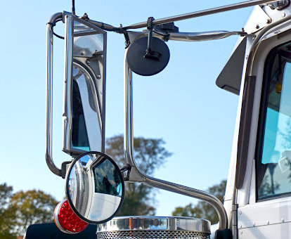 Truck drivers' mirrors can't show everything, and a collision will require you call a blind spot truck accident lawyer.