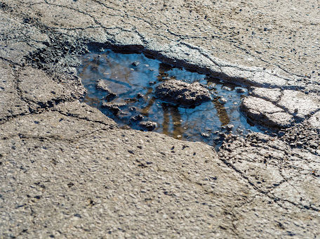 A deep pothole filled with water in Louisiana