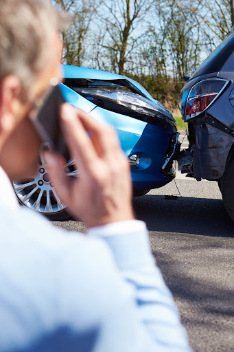 A man calls his Alexandria car accident lawyer after a rear-end collision.