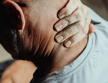 A man holds his neck in pain from an injury in Louisiana.