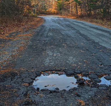 Potholes like this make for dangerous road conditions.