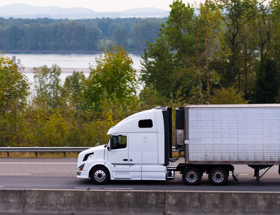 A white truck driving down a Louisiana road