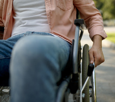 Closeup of a man using a wheelchair