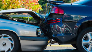 Auto accident involving two cars on a city street