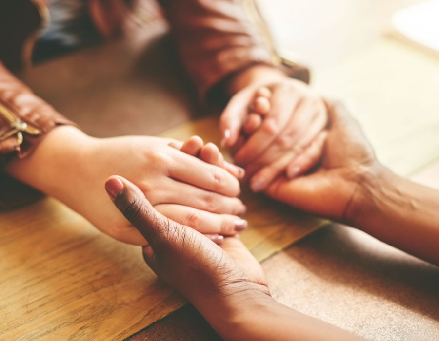 family holding hands after death