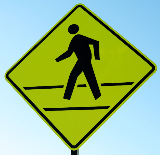 A yellow pedestrian crossing sign in Louisiana.