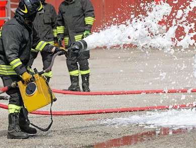 Firefighters spray AFFF, a fire extinguishing foam and a toxic substance.