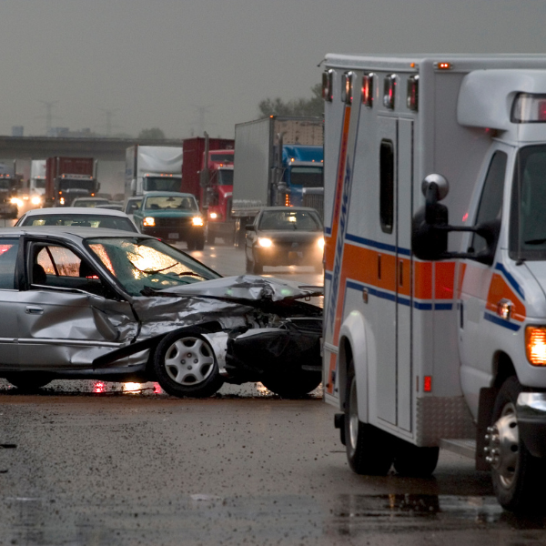 ambulance at scene of car accident on a highway