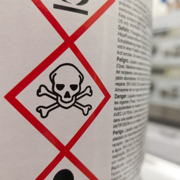 poison label on the side of a container