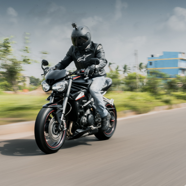 person riding on motorcycle wearing a helmet