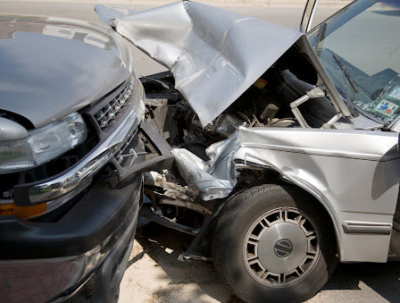 Two cars with front-end damage from a wrong-way collision