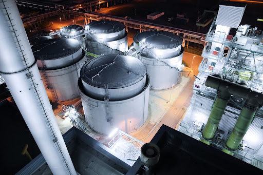 An overhead shot of an oil refinery at night