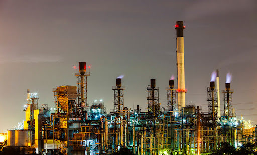 An oil refinery from a distance at dusk