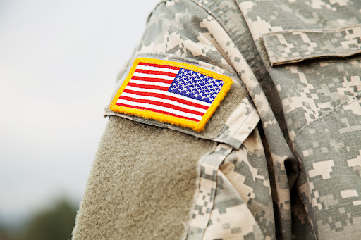 An American flag patch on the shoulder of a U.S. Military servicemember
