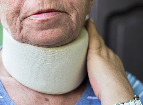 A woman wears a neck brace