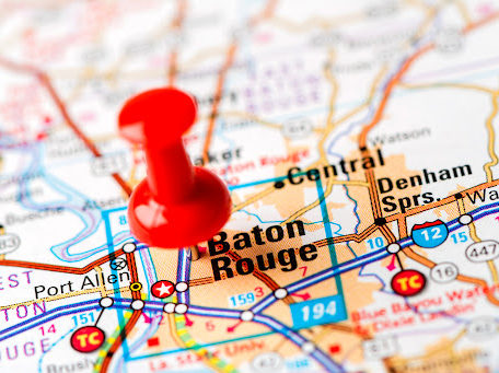A map of Louisiana with a red pin marking Baton Rouge