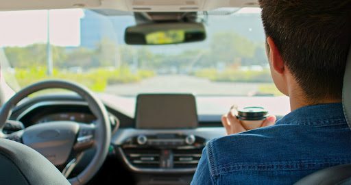 A passenger rides in a self driving car with no physical driver