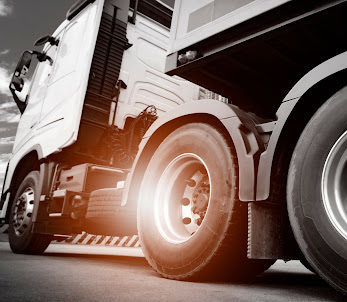 The wheels and undercarriage of a commercial truck