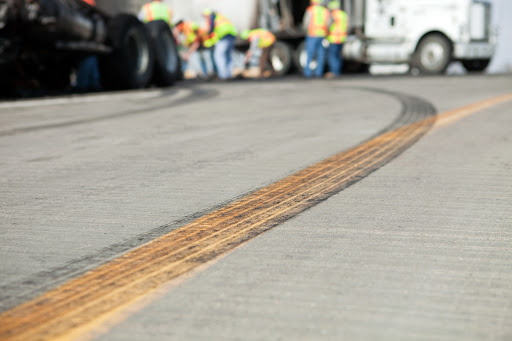 Skid marks on asphalt after an 18 wheeler accident