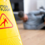 Wet floor sign injured man