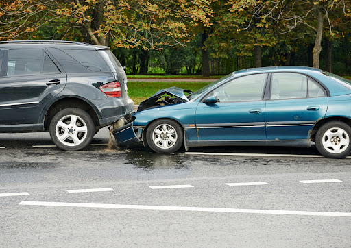 A rear end-collision between two cars resulting from tailgating