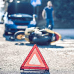 Warning Triangle On A Car And Motorcycle Accident Scene