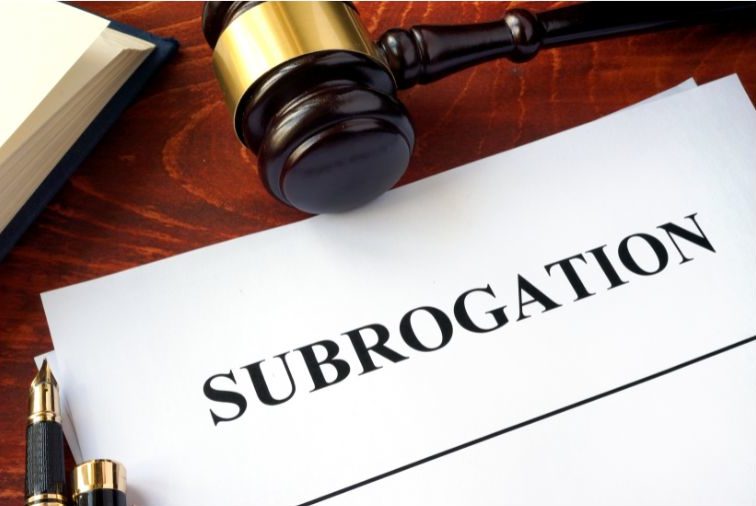 Subrogation typed on paper next to gavel on desk