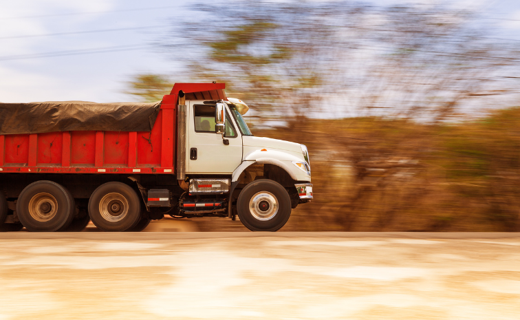 Dump truck speeding down highway