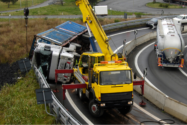 dump truck tipped over on sharp turn