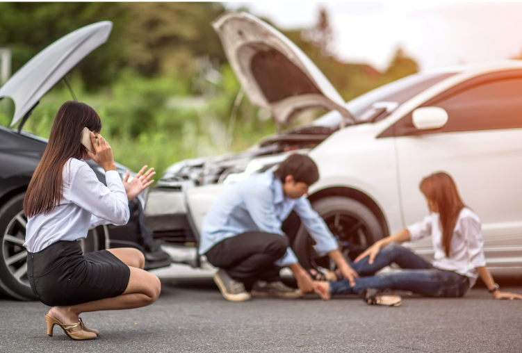 car crash due to negligent driver with man checking out injured passenger and lady on phone