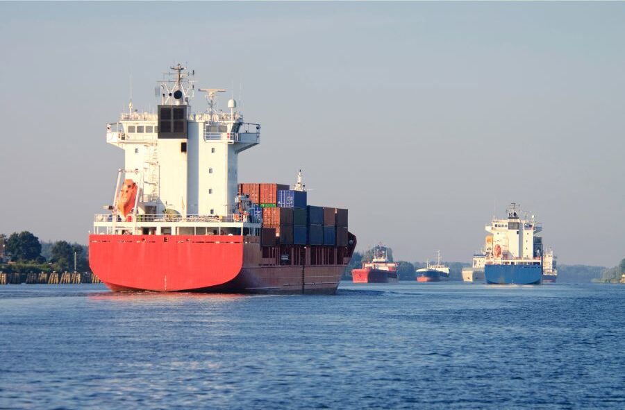container boat and ship in river with passenger ships