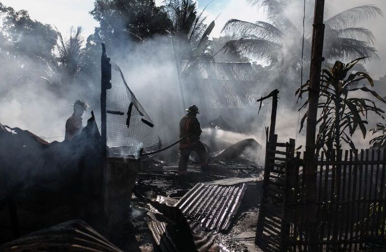 firefighters on scene from hurricane damaged home