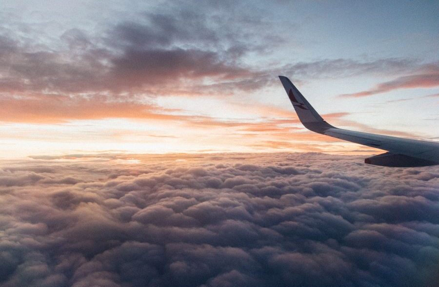 plane fin at sunset with billowing clouds