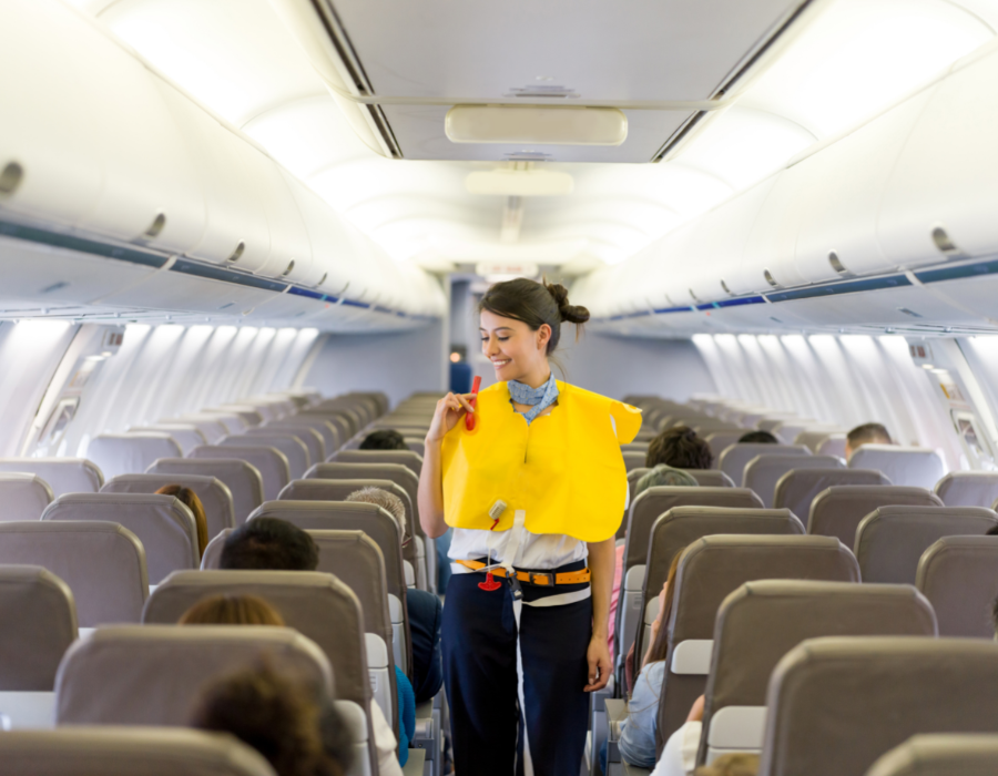 flight attendant going over safety protocols