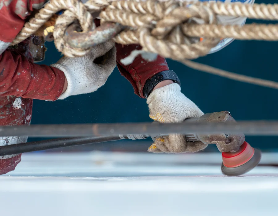 seaman hosing off deck