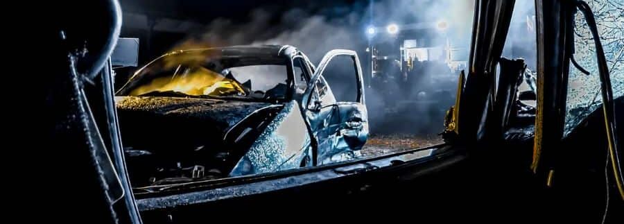 wrecked cars shot at night time