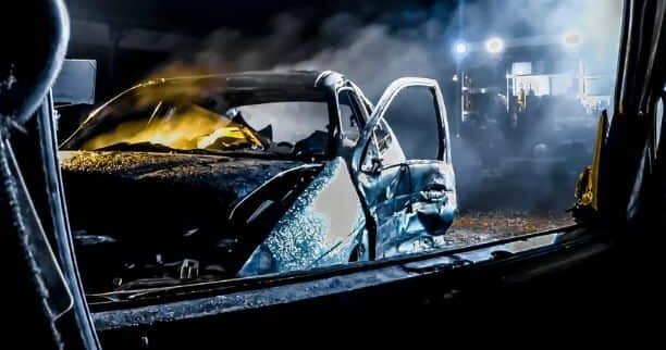 wrecked cars shot at night time