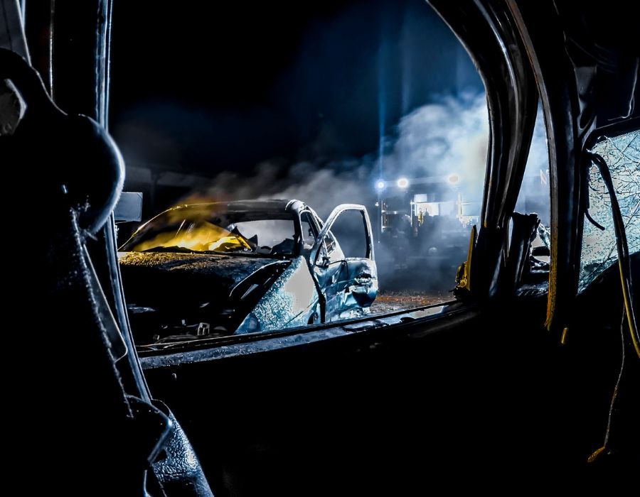 wrecked cars shot at night time