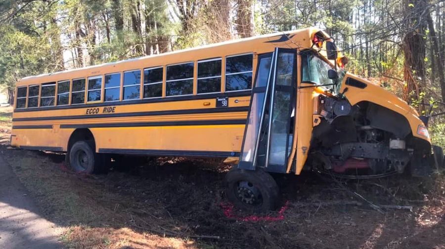 bus leaning off side of road